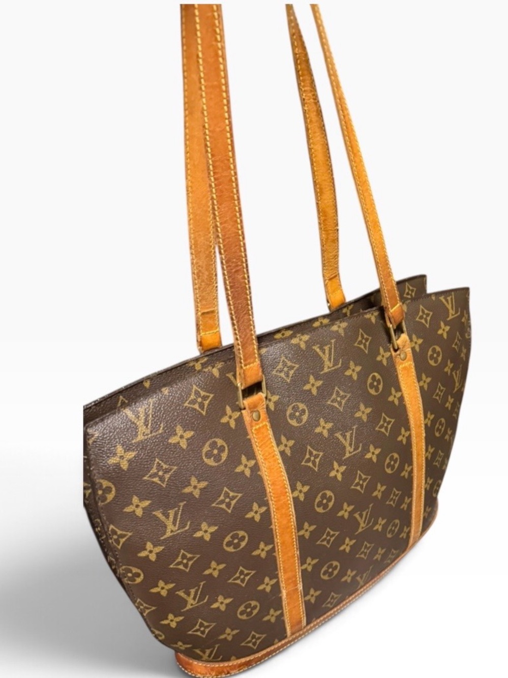 Louis Vuitton Babylon MonoCanvas Tote with Tan Leather Straps with dust bag.